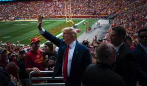 Big Crowd Cheers: Trump Flips Burgers at Raucous College Tailgate